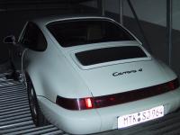 Porsche 911 Typ 964 Carrera 4 - Ansicht hinten links (m. Blitz)